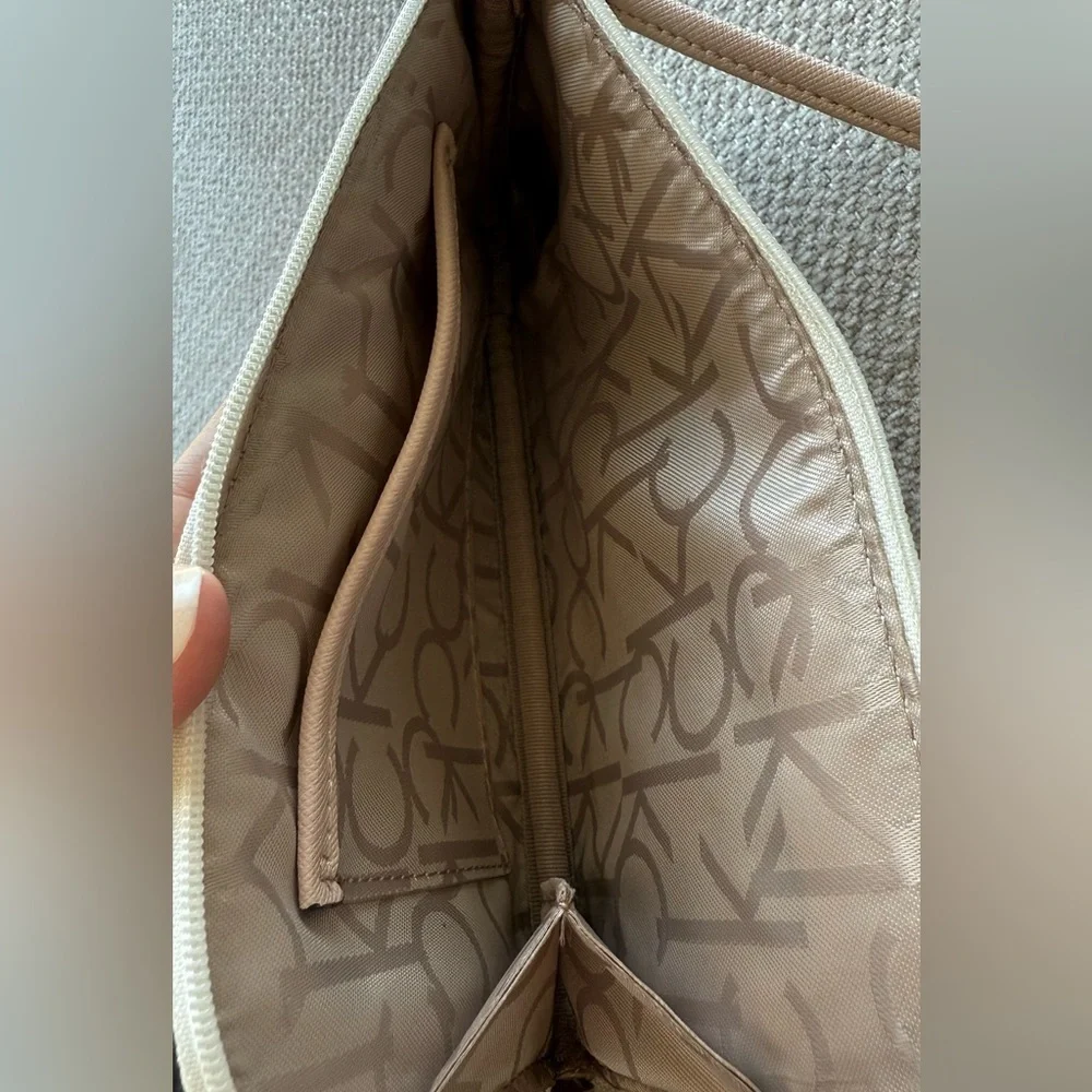 Calvin Klein Signature Pattern Wristlet in Cream and Tan